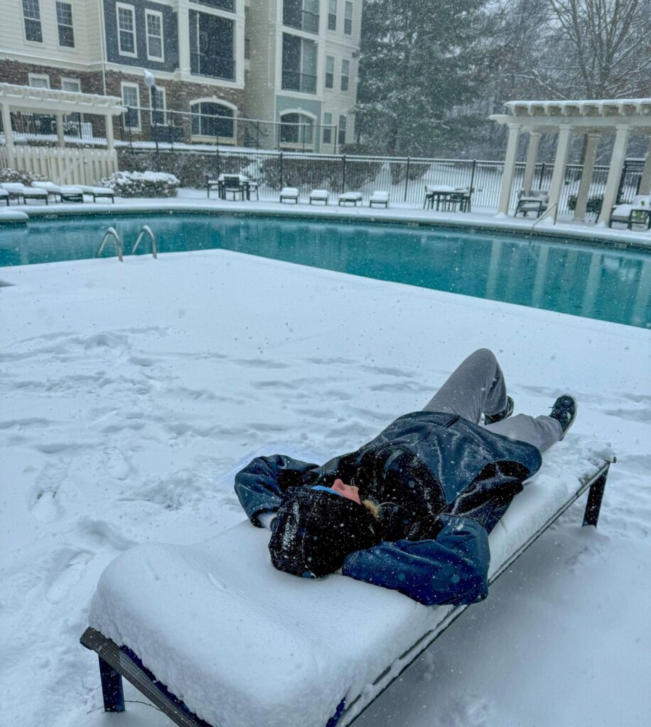 Team members enjoying winter activities during the snow-in period.