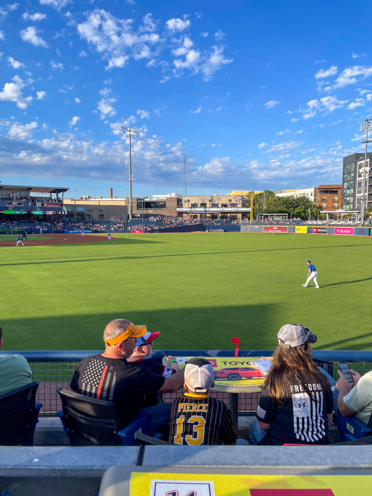 Photo of team members and their family watching the Sounds Game in Nashville.