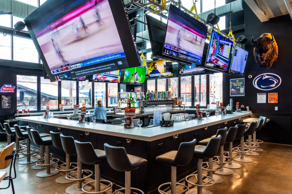 View of folding glass doors opening to the outdoor patio, creating an indoor-outdoor dining experience.